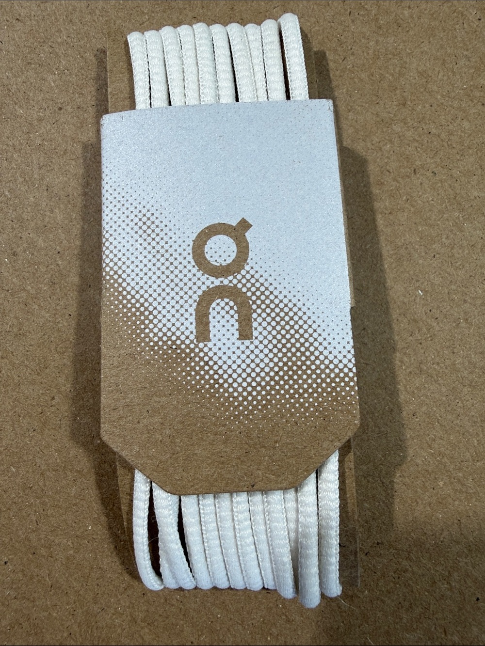 On Running White Braided Charging Cable with Branded Card
